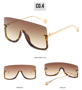 Detailed views of oversized shield sunglasses with star accents and gradient lenses