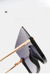 Close-up of golden hinges on oversized sunglasses with ultra-light elastic frame