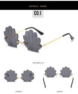 Detailed views of creative shell-shaped rimless sunglasses with gold metal temples