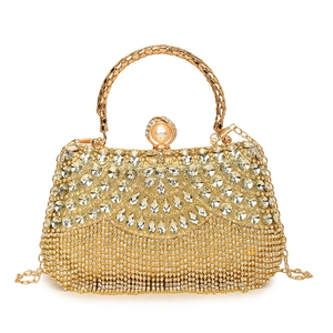 Golden rhinestone tassel evening handbag with pearl clasp and chain shoulder strap