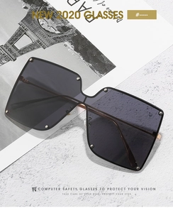 Detail view of oversized square sunglasses with metal rivets and fashion lenses