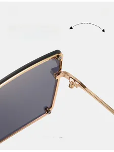 Detail of durable gold metal hinge on oversized square flat top sunglasses
