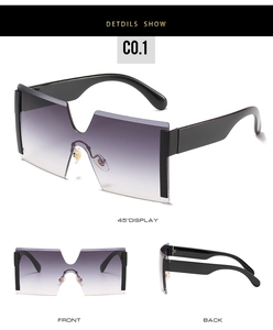 Close-up of oversized rimless sunglasses featuring purple gradient lenses and sturdy black temples