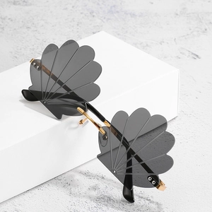 Chic shell-shaped rimless sunglasses with gold metal temples and smoke grey lenses