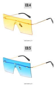 Detailed 45-degree view of oversized square sunglasses in gradient yellow and blue lenses