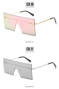 Detail view of oversized square sunglasses with metal rivets and gradient colorful lenses