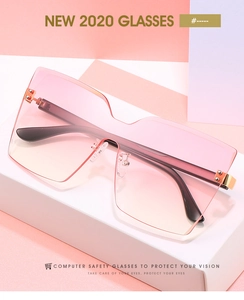 Détail de lunettes de soleil sans monture surdimensionnées avec dégradé rose et métal