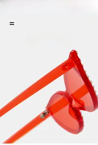 Detail of red heart sunglasses with colorful rhinestones and lightweight elastic frame