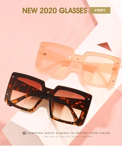 Détail de lunettes d'ordinateur carrées en écaille et orange avec rivets métalliques