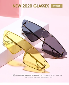 Detail of cat-eye sunglasses with golden rivets and metallic temples on pink background
