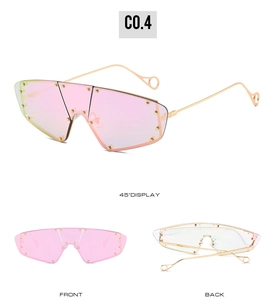Detail views of oversized pink cat-eye sunglasses with gold rivet accents and metal arms