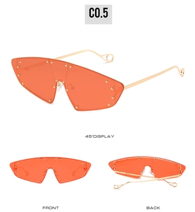 Three-angle display of cat-eye sunglasses with orange lenses and golden rivet studs