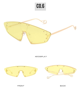 Detailed views of yellow shield cat-eye sunglasses featuring metal rivet studs and gold temples