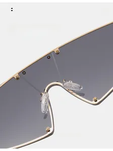 Detail view of comfortable silicone nose pads on gold metal cat eye sunglasses