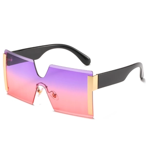 Fashionable oversized rimless sunglasses with purple gradient lenses and gold accents