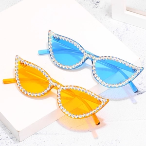 Fashionable cat eye sunglasses with rhinestones in blue and yellow lens variants