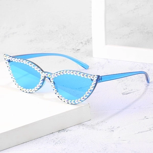 Blue cat eye sunglasses with hand-set rhinestones and a transparent frame