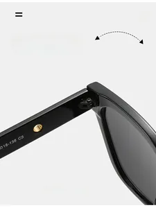 Macro shot of durable metal hinge on black sunglasses showing 16-138 C5 specs