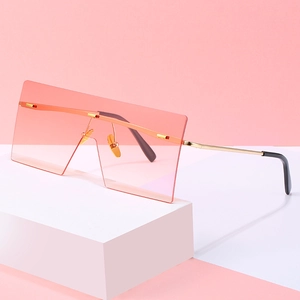 Oversized rimless square sunglasses with pink gradient lenses and gold metal temples