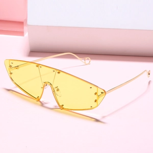 Retro cat-eye sunglasses with yellow transparent lenses and gold rivet accents