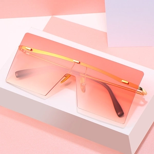 Fashionable oversized square sunglasses with gradient orange lenses and gold metal temples