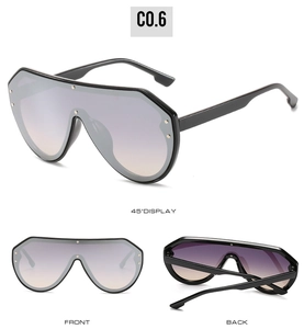 Detailansicht der Oversize-Sonnenbrille mit Silbernieten und violetten Verlaufsgläsern