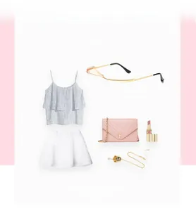 Flat lay of stylish pink teardrop sunglasses with rhinestones and fashion accessories