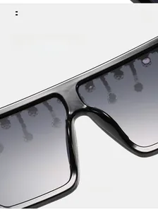 Detail of comfortable nose pads on black square frame oversized rhinestone sunglasses