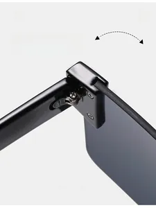 Macro shot of durable metal hinge on sleek black rimless oversized sunglasses
