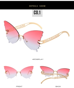 Detailed close-up of butterfly rimless sunglasses with pink gradient lenses and metal frames