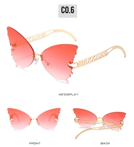 Detailed views of rimless butterfly sunglasses with red gradient lenses and gold temples