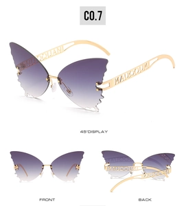 Detailed view of butterfly sunglasses with purple gradient lenses and gold hollow temples