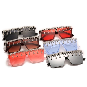 Oversized square sunglasses set with sparkling rhinestone fringe in multiple vivid lens colors