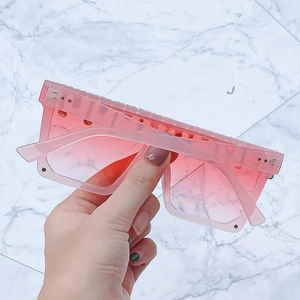Oversized square frame sunglasses with pink gradient lenses and sparkling rhinestone details