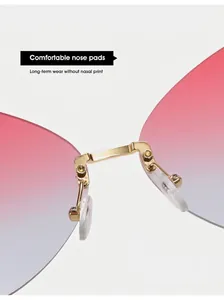 Close-up of comfortable gold metal nose pads and gradient lenses on butterfly sunglasses