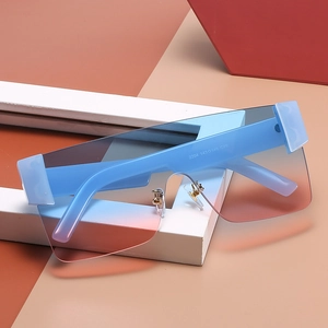 Frameless oversized square shield sunglasses with blue and orange gradient lenses