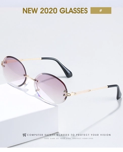 Detailed close-up of rimless oval sunglasses with purple gradient lenses and gold metal temples