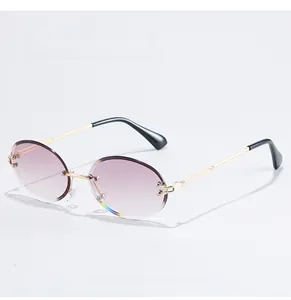 Detail of rimless oval sunglasses featuring purple gradient lenses and gold metal temples