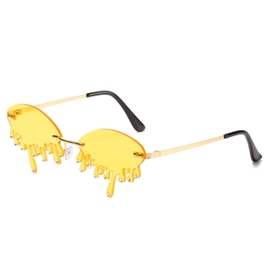 Fashionable melting teardrop sunglasses with yellow lenses and gold metal frame