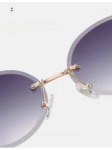 Detail of comfortable silicone nose pads and golden metal bridge on rimless sunglasses