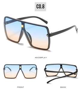 Detail of square sunglasses with blue-orange gradient lenses and gold rivet accents