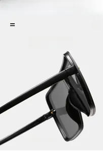 Detail view of durable hinges and frame texture on square oversized sunglasses