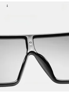 Macro shot of comfortable integrated nose pads and frame detail on black square sunglasses