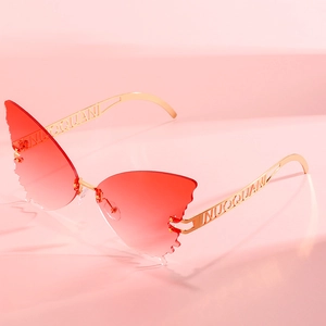 Oversized butterfly shaped rimless sunglasses with red gradient lenses and gold temples
