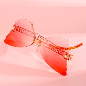 Chic butterfly-shaped sunglasses with red gradient lenses and gold metal frames