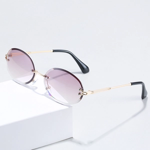 Frameless oval sunglasses with light purple gradient lenses and gold metal frames