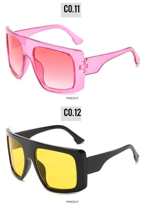 Front detail of oversized square sunglasses in pink gradient and black with yellow lenses