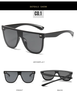 Detailansicht der schwarzen Flat-Top-Oversize-Sonnenbrille mit silbernen Nieten und Farbverlauf