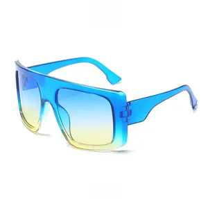 Side view of oversized square sunglasses featuring blue-yellow gradient lenses and frames