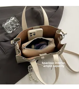Macro shot of spacious beige tote bag interior featuring a matching removable zipper pouch